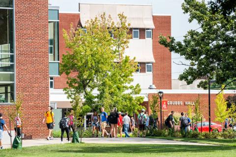 Describe mCampus Exterior Oval Buildings Students Downtown Community