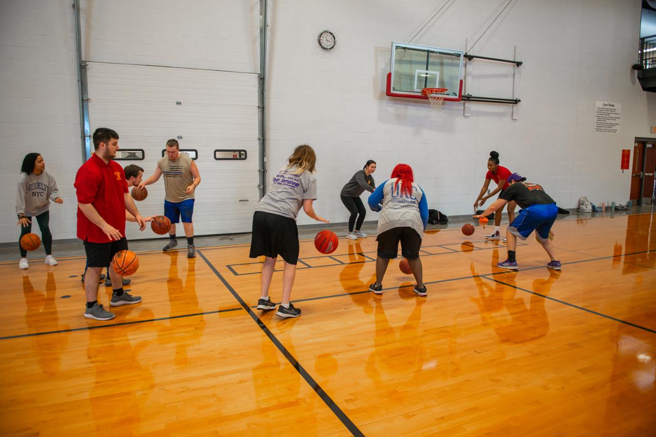 students participating in basketball drills