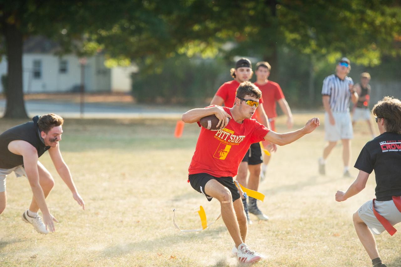 students playing football