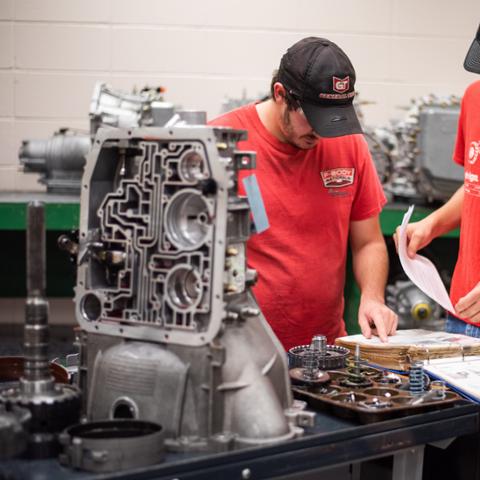 Automotive Lab Students of Pittsburg State University work onGarage Engines Air Conditioning