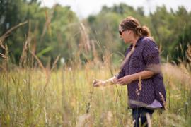 Dr. Dixie Smith in grassland at O'Malley Prairies