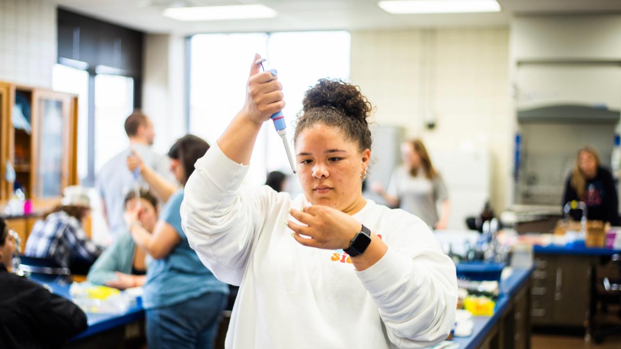 Biology student working in class