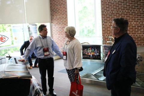 One of CHECK's sponsors showing off an advanced printer that they brought.