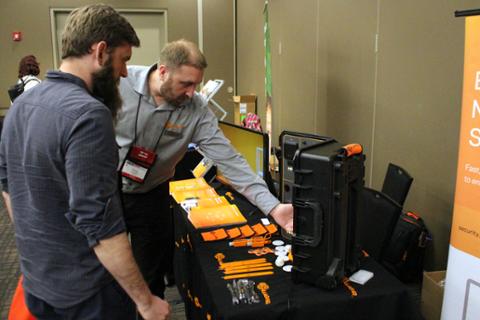 One of CHECK's sponsors showing off some cool technology that his company has been working on.