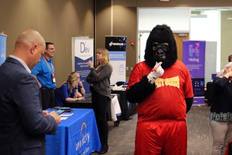 Gus checking out what the sponsor booths have to offer.