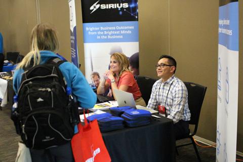 Representatives of Sirius, a CHECK sponsor, at their booth.