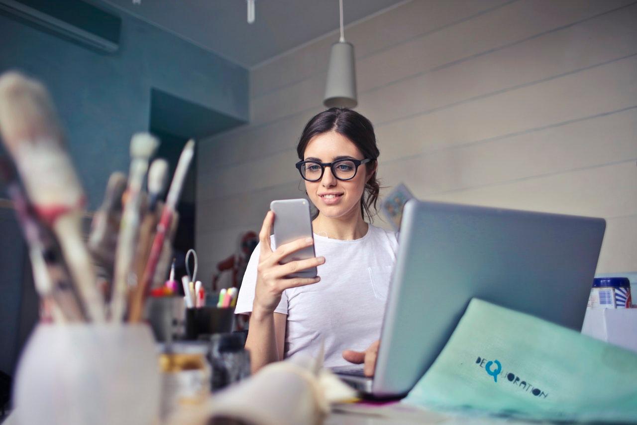 Student with Phone and Computer