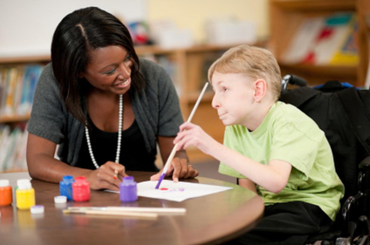 Student in Wheelchair and Teacher