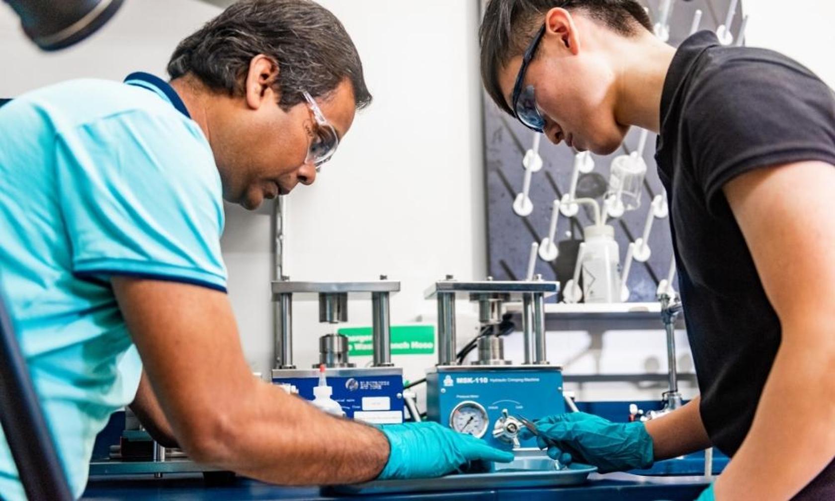 Ram Gupta in the lab with a student