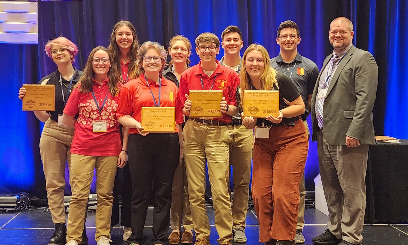 Students with award and Byron