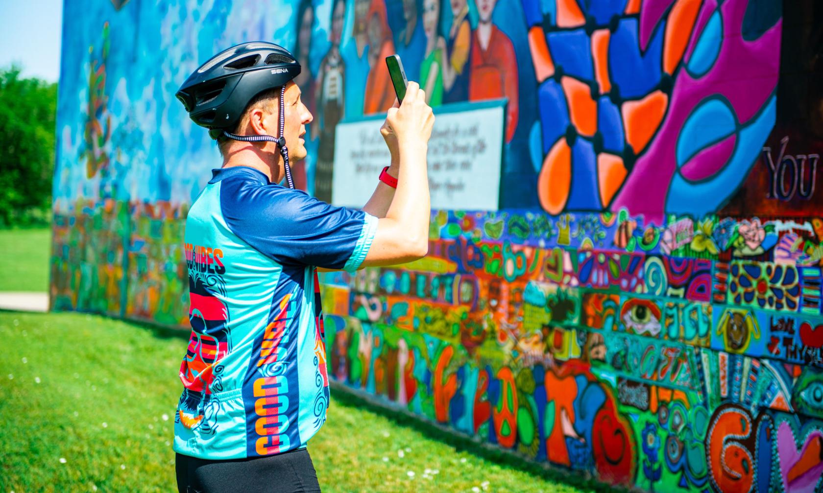 Dan taking a photo of the mural