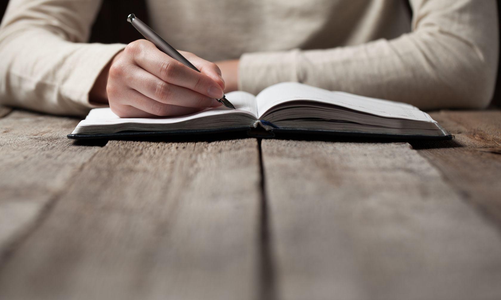 writer with book and pen