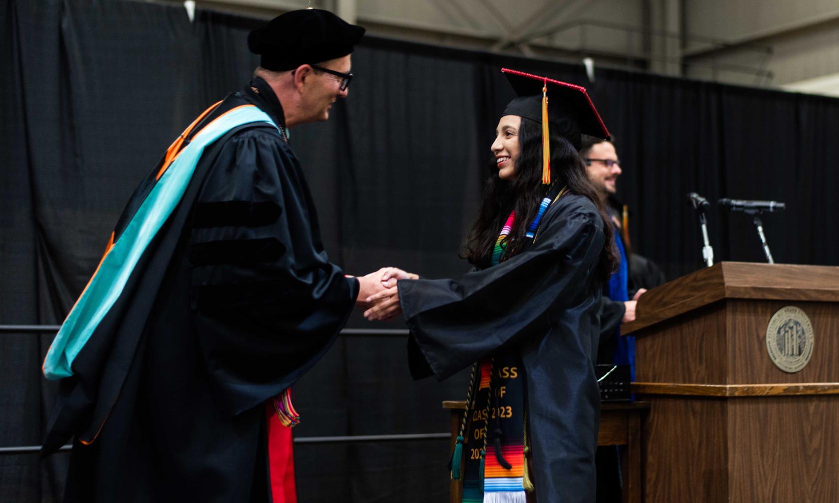Graduate getting diploma from president