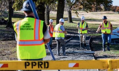 Construction students work on cart path