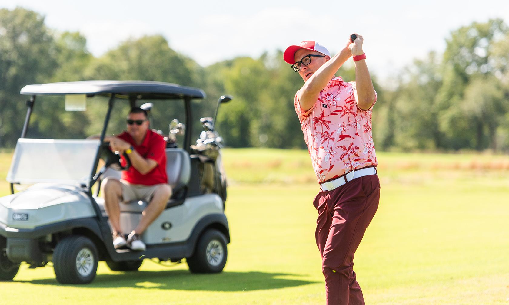 president dan shipp golfing