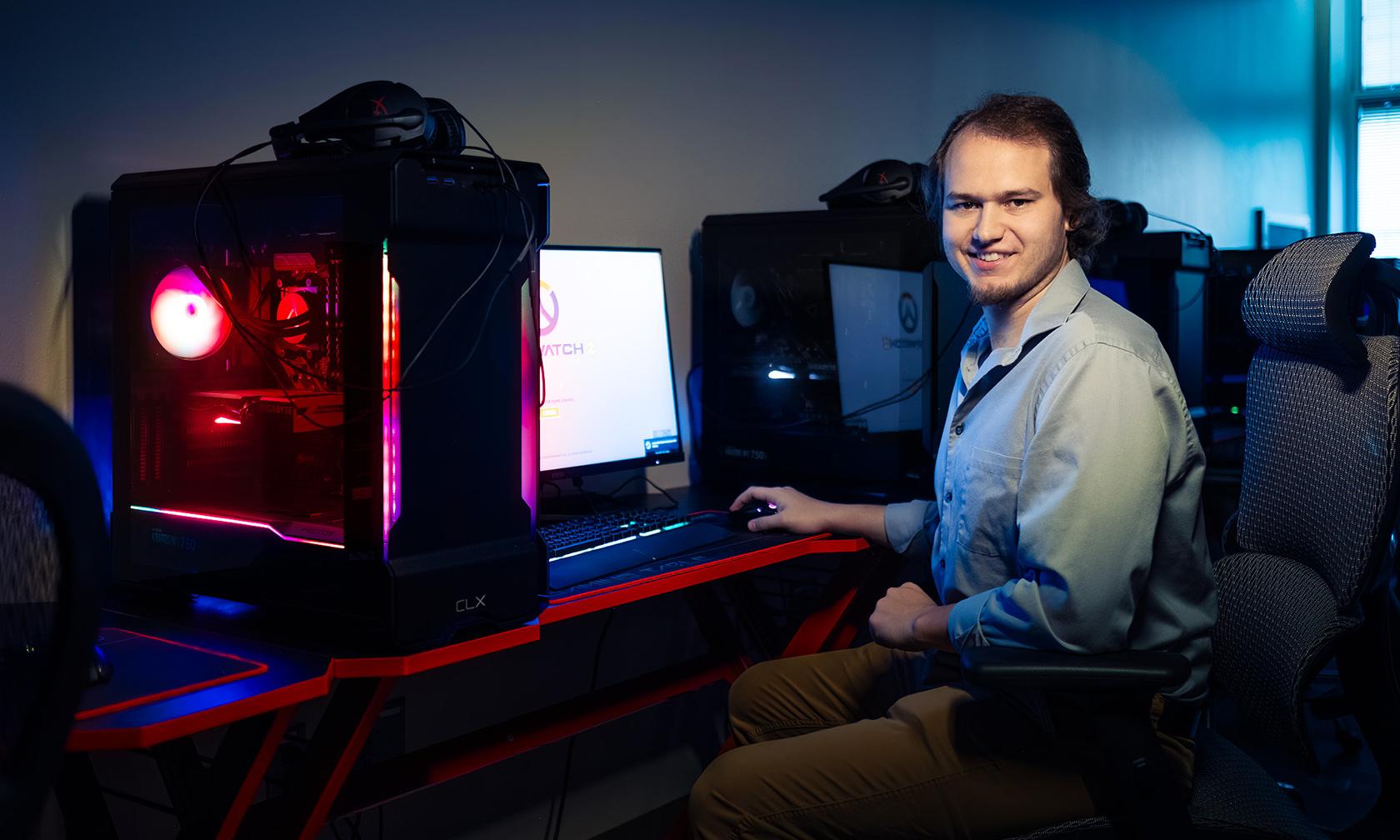 Man sitting at gaming station