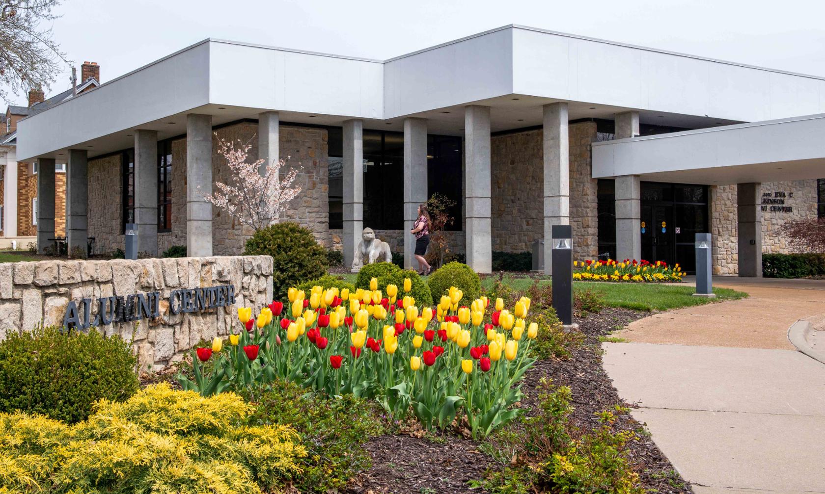 Alumni Center with tulips in springtime