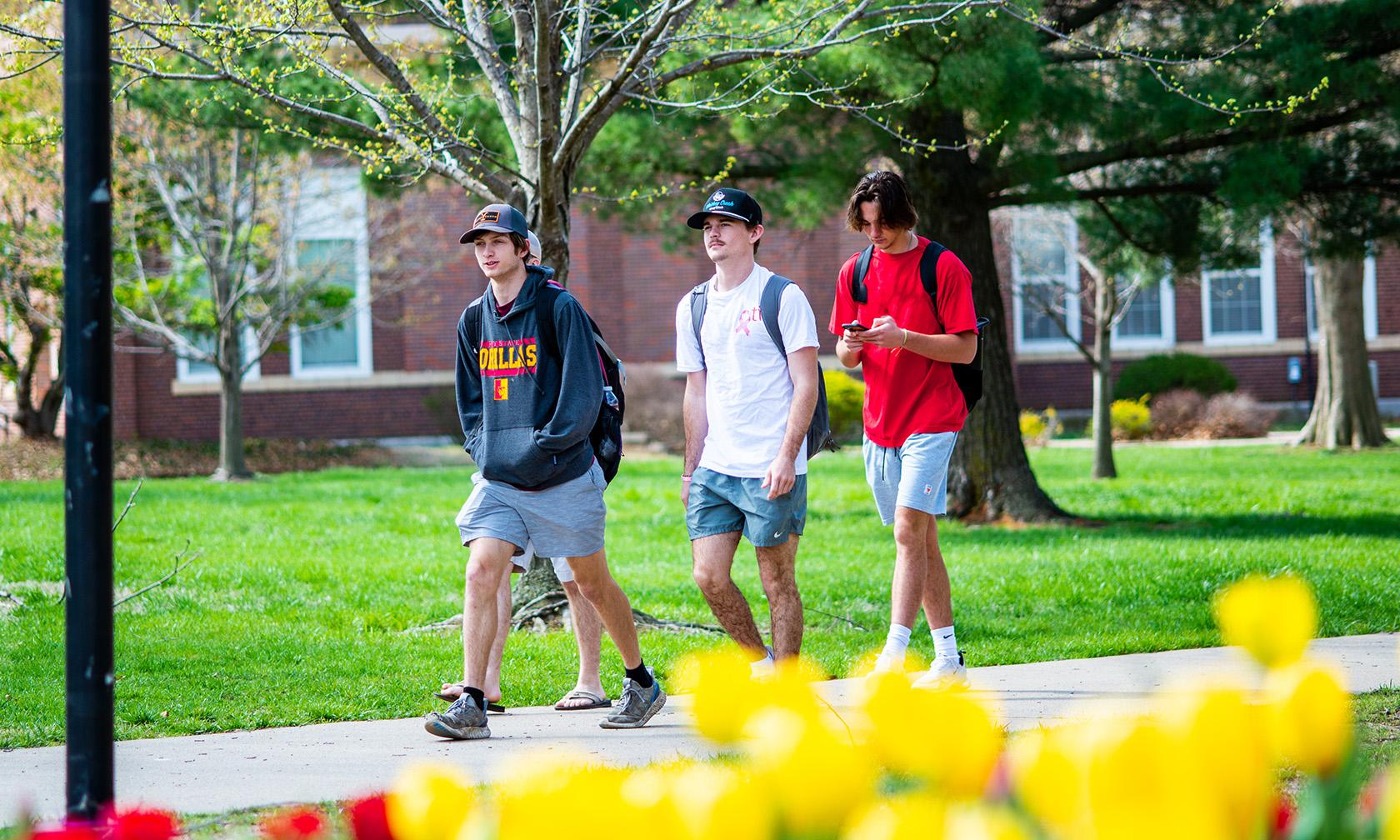 students walking across campus