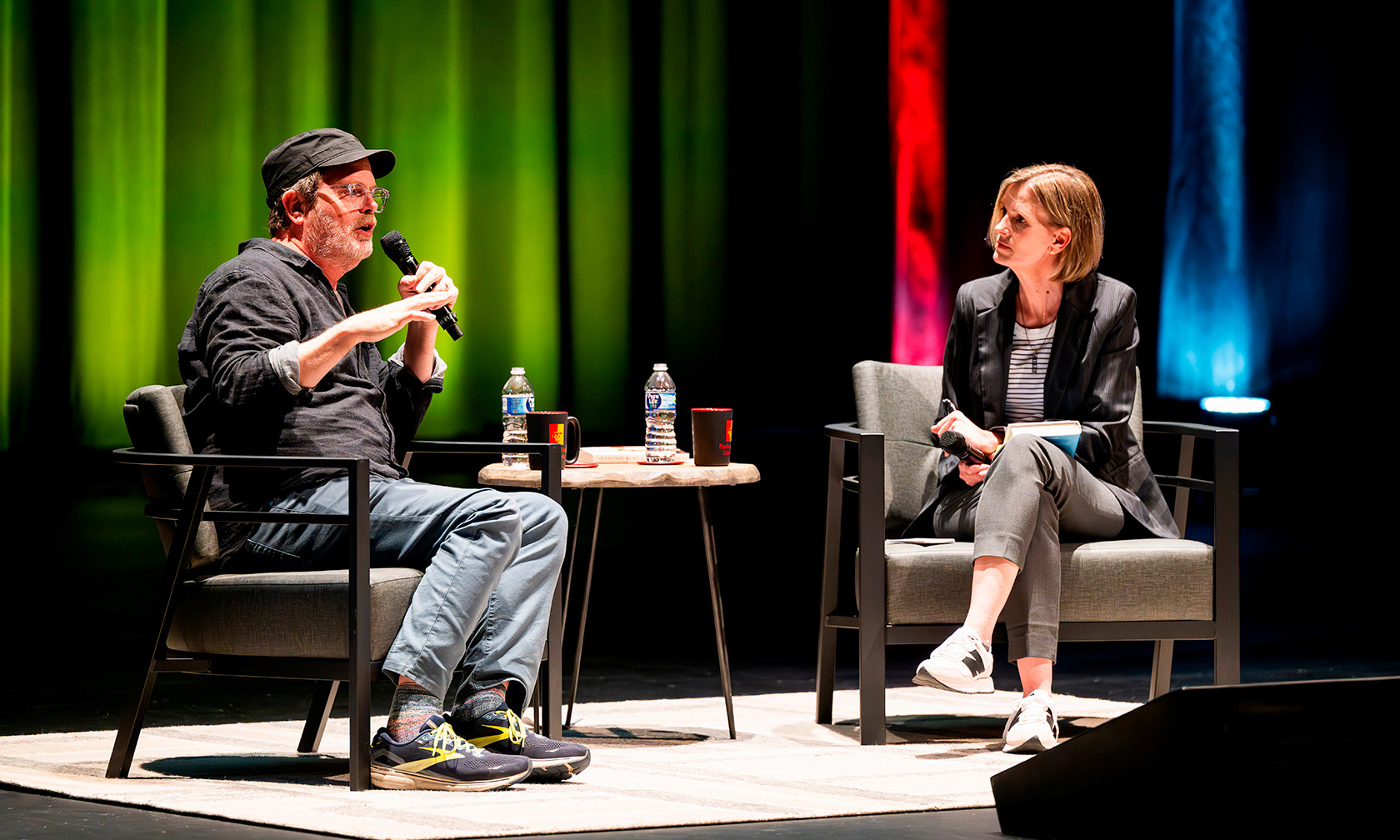 Rainn Wilson and Andra Stefanoni talking on stage 