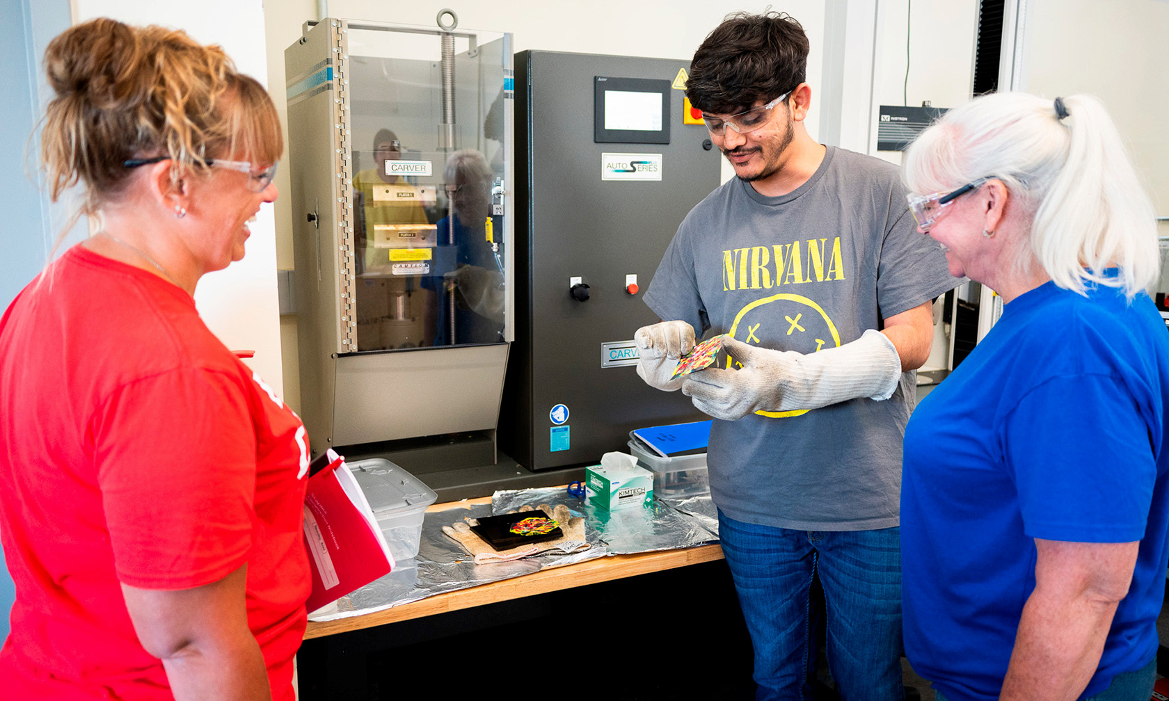 teachers looking at scientist in lab