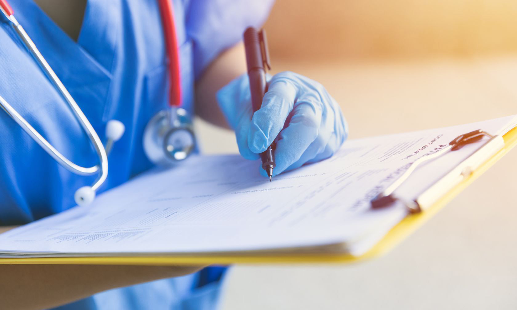 nurse examiner with clipboard