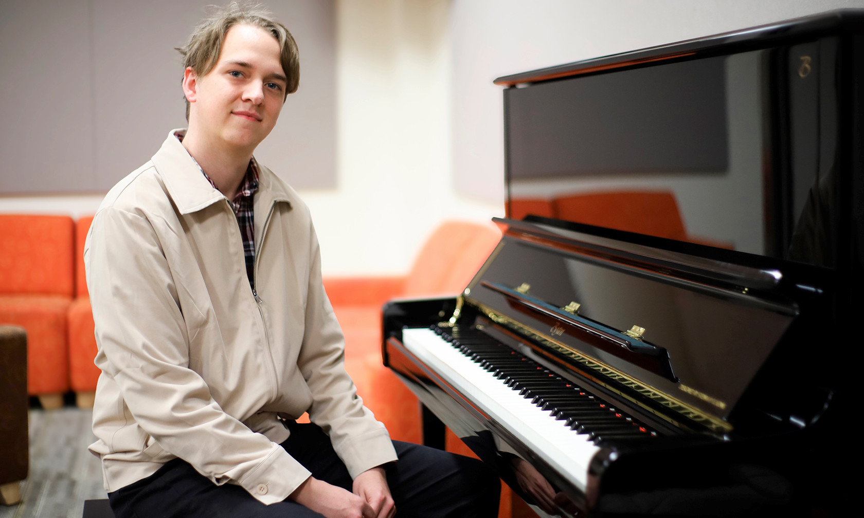 Student Jude Wolfe at piano