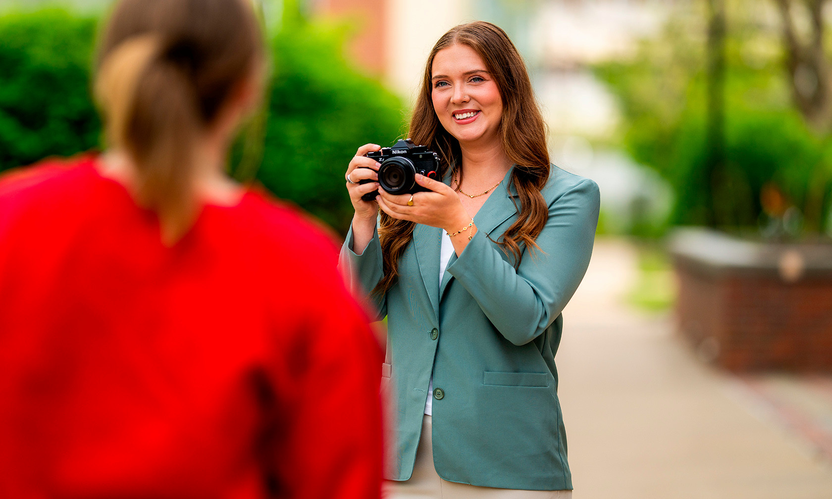 student with camera