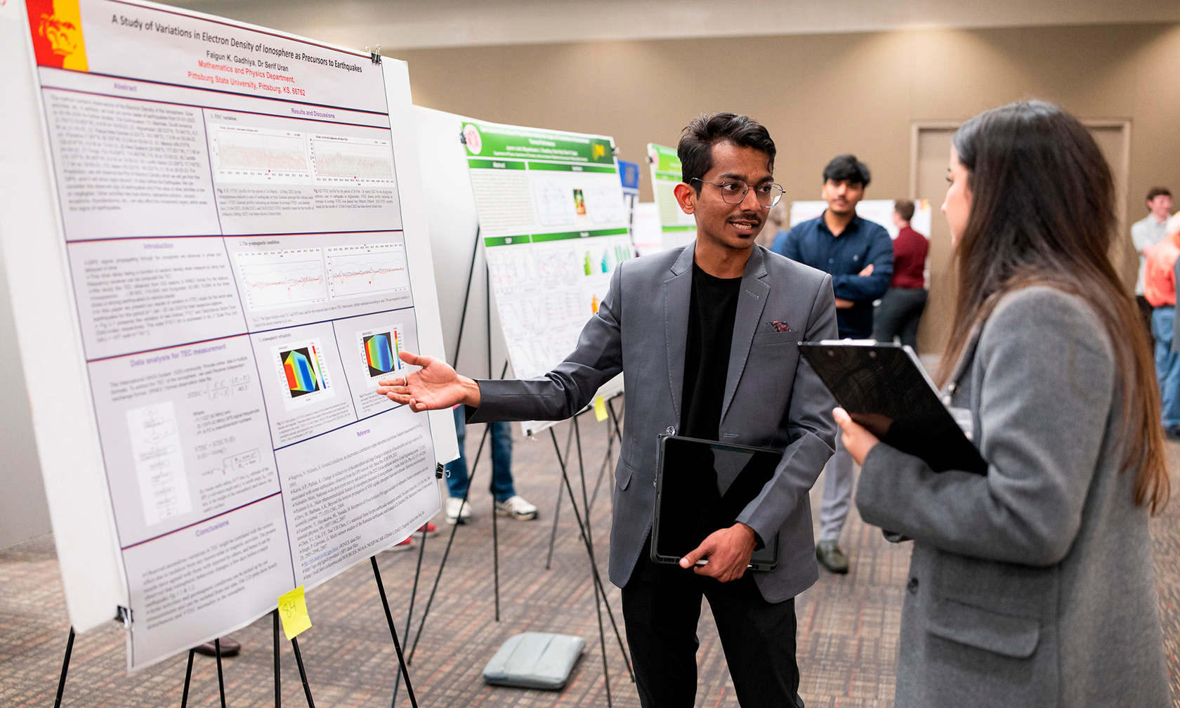 student showing a research project