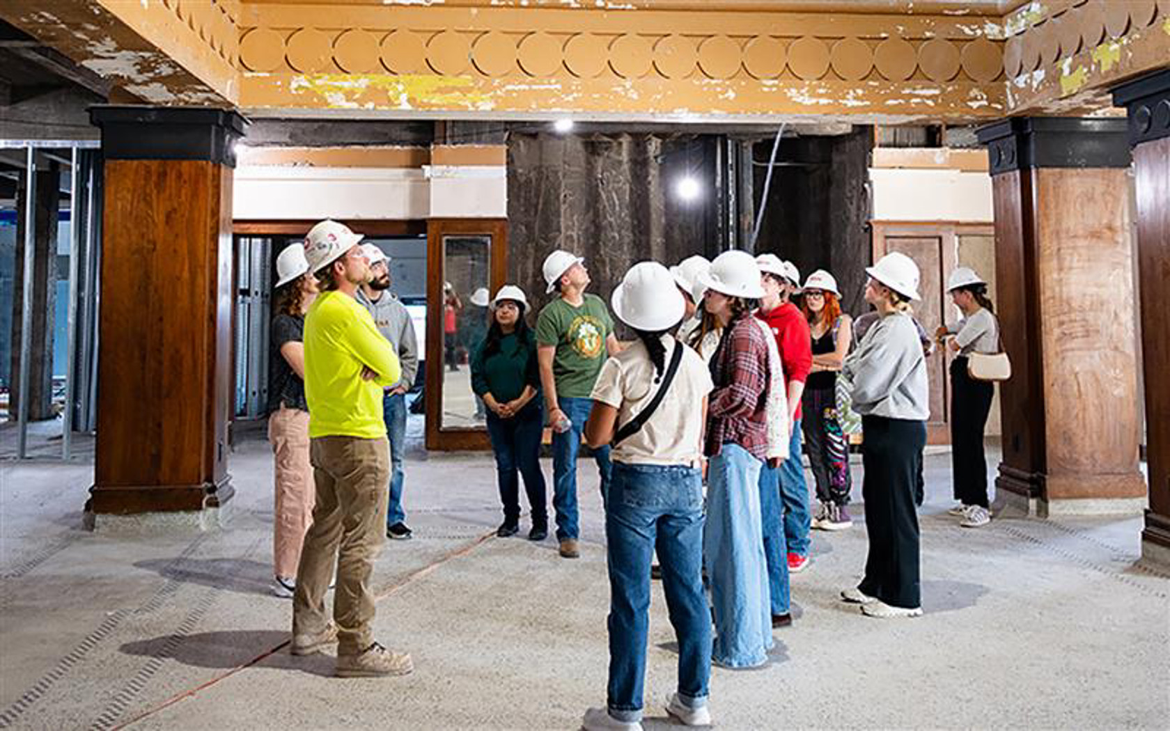 Inside Besse Hotel with students engaging