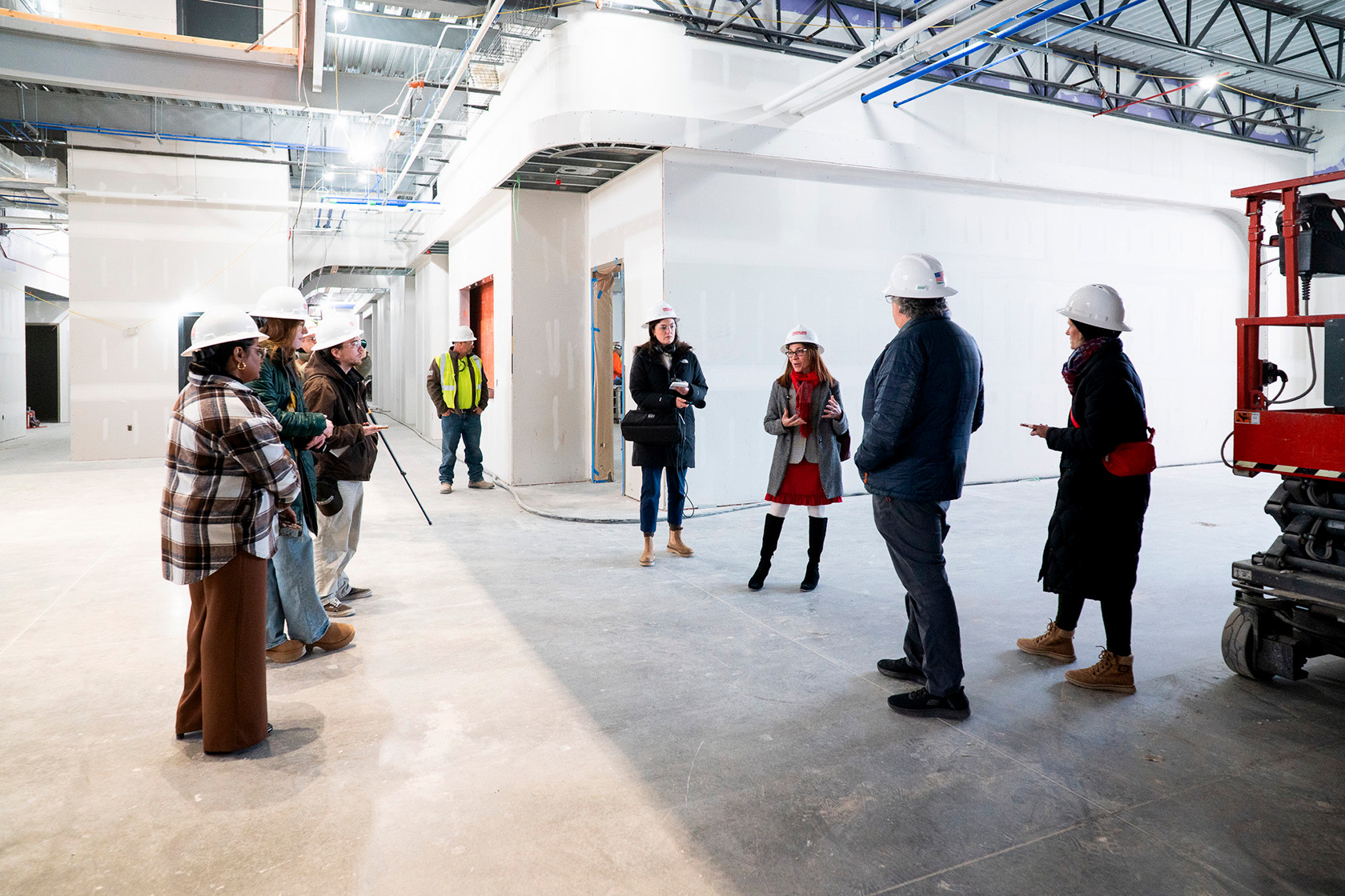 Provost speaking to group in construction area