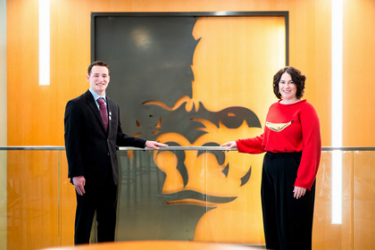 two students stand infant of the split face in the overman