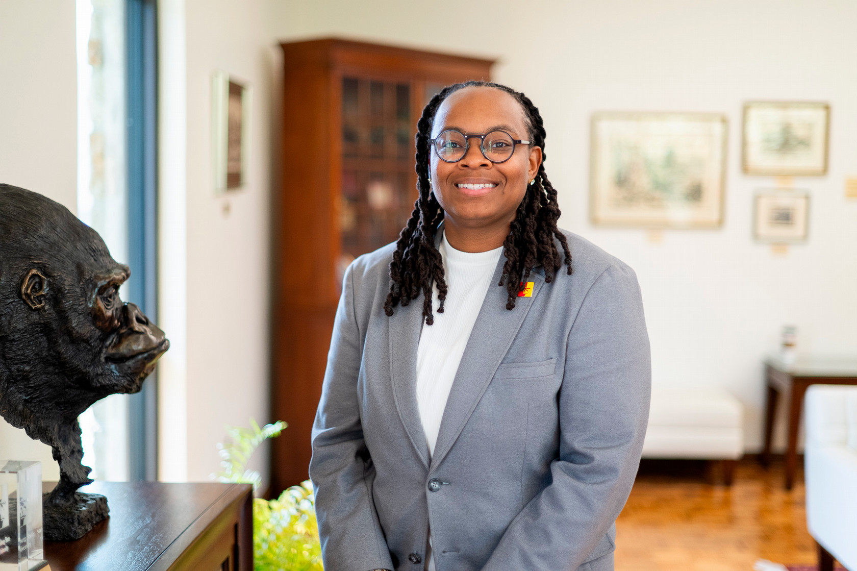 DePrice poses for a photo inside the alumni building on campus
