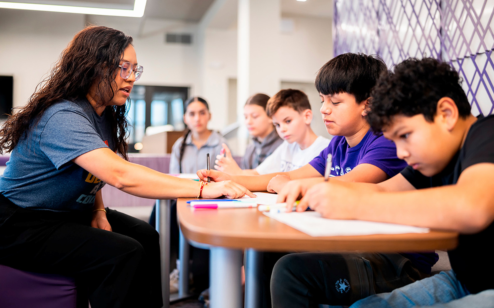 Psychology student works with many students at Pittsburg Grade School