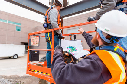 construction students working outdoors on project
