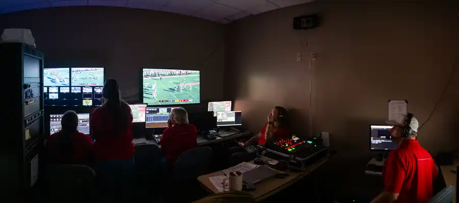 students in front of monitors in a studio