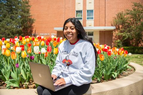 Student on Pitt State campus for college courses