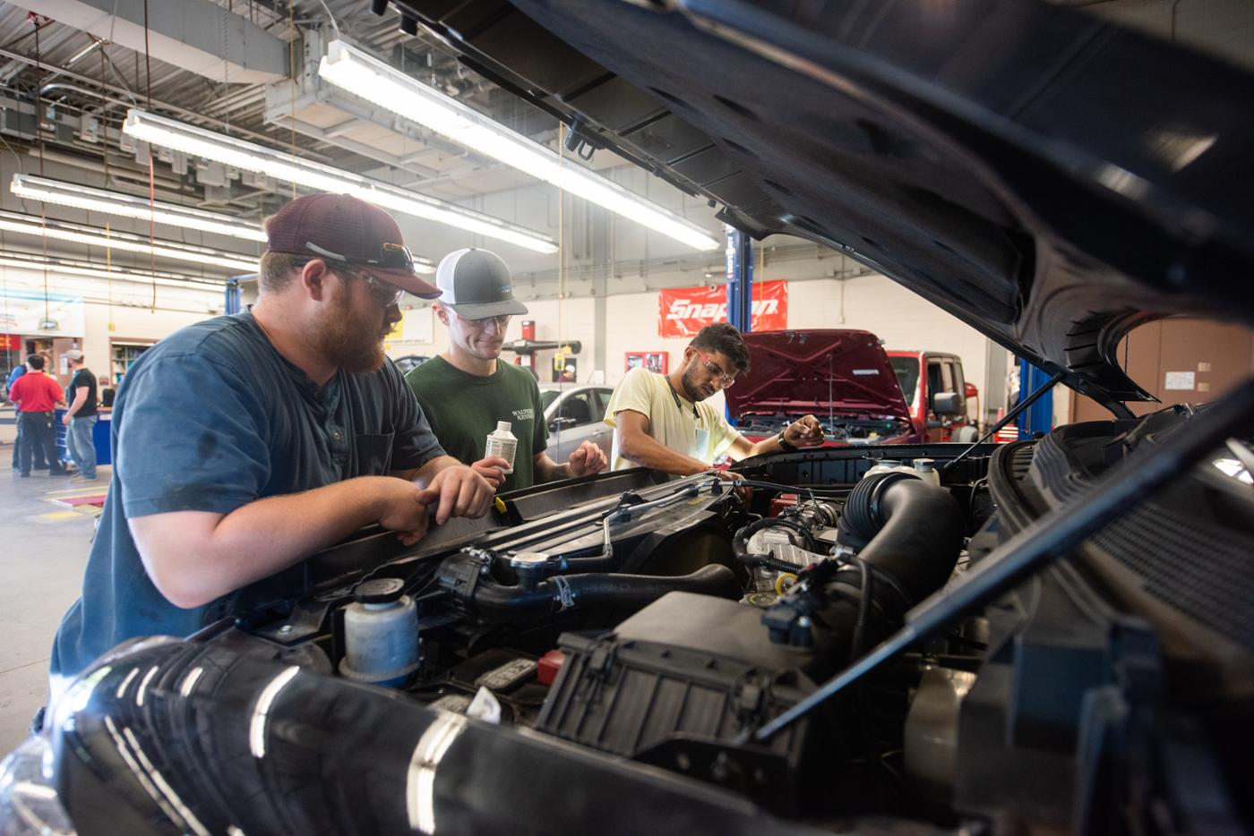student with professor diagnosing car in automotive technology program at Pittsburg State