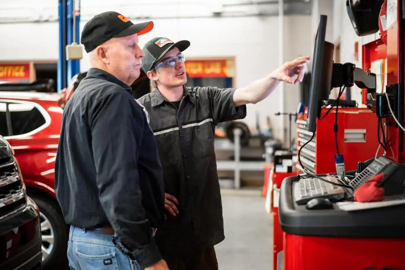 student with automotive instructor