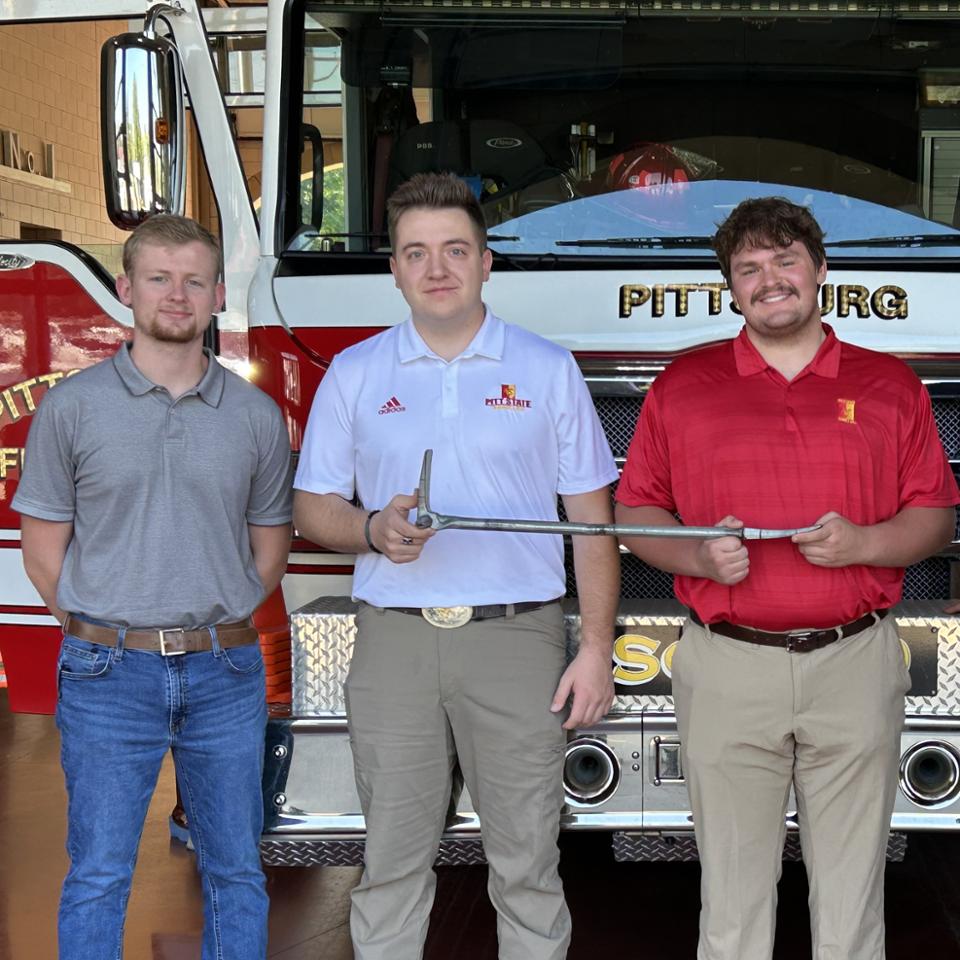 Mechanical Engineering Technology majors with halligan bar at Pitt State Fire Department