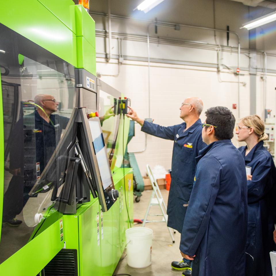 Students in engineering technology classroom for plastics program