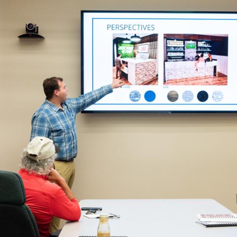 Interior design student giving presentation at pitt state