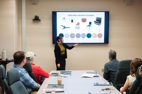 Interior design student giving proposal presentation at pitt state