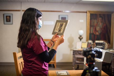 Students in library collection archive at Pittsburg State University for history project