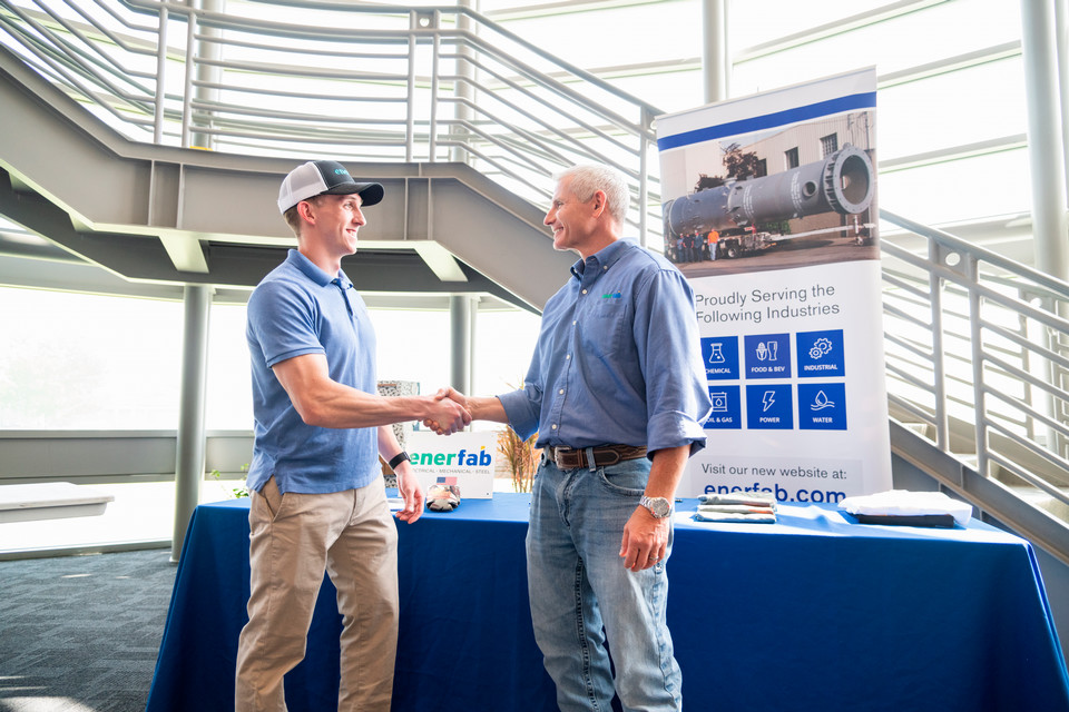Student shaking hands with future employer